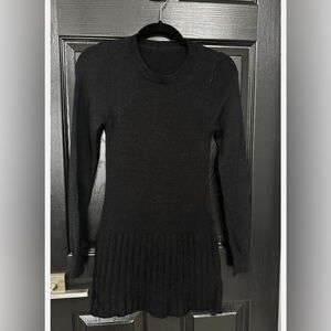 Women’s black ribbed sweater dress featuring a crew neckline Size S